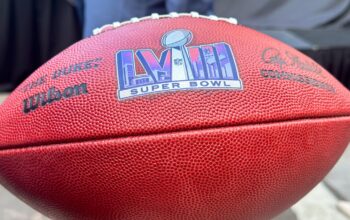 The official logo for Super Bowl LVIII.Today, we got our first look at the logo for Super Bowl LVIII via a photo from the Las Vegas Super Bowl Host Committe's handoff meeting.