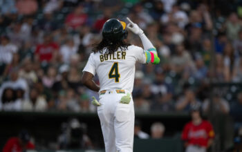 Athletics outfielder Lawrence Butler hits a home run against the Braves.